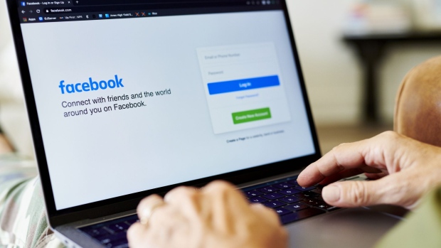 The website home screen for Facebook is displayed on a laptop computer in an arranged photograph taken in Little Falls, New Jersey, U.S., on Thursday, Oct. 8, 2020. Facebook Inc. is tightening its rules on content concerning the U.S. presidential election next month, including instituting a temporary ban on political ads when voting ends, as it braces for a contentious night that may not end with a definitive winner. Photographer: Gabby Jones/Bloomberg