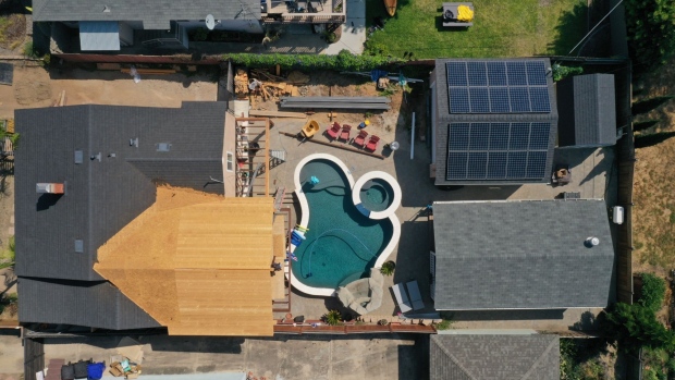 A home with a backyard pool and rooftop solar panels under construction in this aerial photograph taken over the Pacific Beach neighborhood of San Diego, California, U.S., on Wednesday, Sept. 2, 2020. U.S. sales of previously owned homes surged by the most on record in July as lower mortgage rates continued to power a residential real estate market that's proving a key source of strength for the economic recovery. Photographer: Bing Guan/Bloomberg
