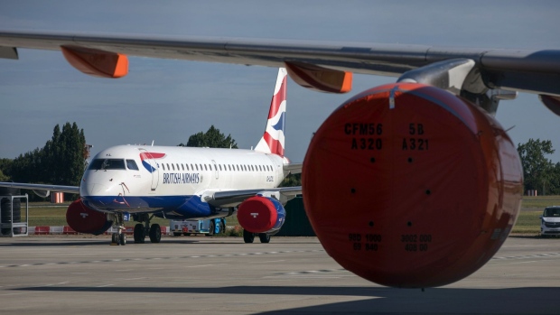 A passenger aircraft, operated by British Airways, a unit of International Consolidated Airlines Group SA (IAG), stands on the tarmac at London Southend Airport, part of the Stobart Group Ltd., in Southend-on-Sea, U.K., on Tuesday, July 7, 2020. EasyJet Plc plans to shutdown bases in Stansted, Southend and Newcastle in the U.K.