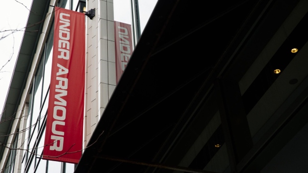 Signage is displayed outside an Under Armour Inc. store on Michigan Avenue in Chicago, Illinois, U.S., on Tuesday, Feb. 11, 2020. Under Armour said its 2020 revenue would fall by a low-single-digit percentage and earnings for the year would be 10 cents to 13 cents a share, far below analysts' estimates as compiled by Bloomberg. Photographer: Taylor Glascock/Bloomberg