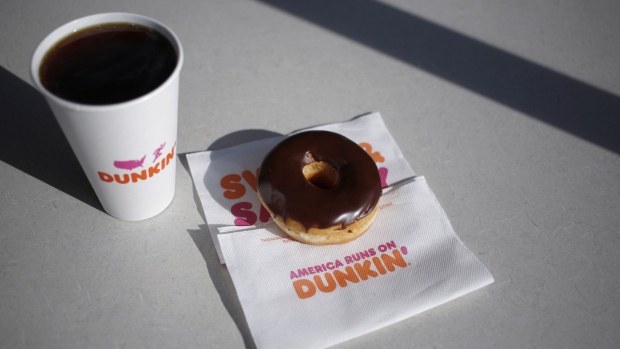 A black coffee and chocolate frosted donut are arranged for a photograph inside a Dunkin' location in Mount Washington, Kentucky, U.S., on Thursday, Jan. 30, 2020. Dunkin' Brands Group Inc. is scheduled to release earnings figures on Feb. 6. Photographer: Luke Sharrett/Bloomberg