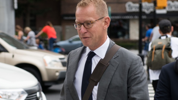 Mark Johnson, former head of global foreign exchange for HSBC Holdings Plc, left, arrives at federal court in the Brooklyn borough of New York, U.S.