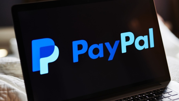 PayPal Holdings Inc. signage is displayed on an Apple Inc. laptop computer in an arranged photograph taken in Little Falls, New Jersey, U.S., on Saturday, July 20, 2019.
