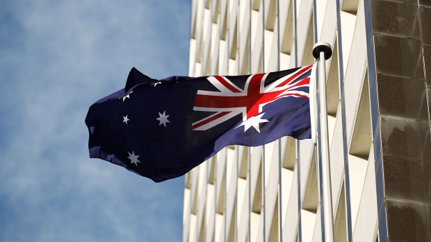 The Australian flag flies outside the Reserve Bank of Australia (RBA) headquarters in Sydney, Australia, on Monday, July 4, 2016. 