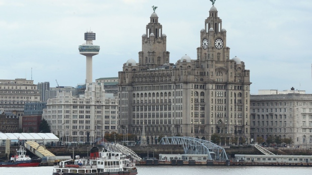 LIVERPOOL, ENGLAND - OCTOBER 14: A passenger ferry is seen in front of the Liverpool waterfront on October 14, 2020 in Liverpool, England. The Liverpool City Region was placed into the highest tier of the government's new three-tier system to assess Covid-19 risk, a designation which forced the area to close pubs and ban household mixing, among other restrictions. (Photo by Lewis Storey/Getty Images)