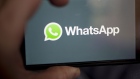 The Facebook Inc. WhatsApp logo is displayed on an Apple Inc. iPhone in an arranged photograph taken in Arlington, Virginia, U.S. on Monday, April 29, 2019. Facebook paid out a $123 million fine to EU antitrust regulators for failing to provide accurate information during their review of Facebook's WhatsApp takeover. Photographer: Andrew Harrer/Bloomberg