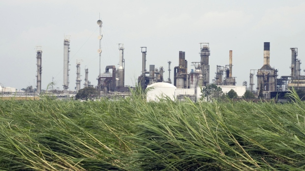 A Motiva Enterprises LLC oil refinery sits idle in shutdown mode after losing power during Hurricane Gustav in Convent, Louisiana, U.S., on Tuesday, Sept. 2, 2008. Motiva Enterprises LLC, the U.S. refining venture of Royal Dutch Shell Plc and Saudi Aramco, said damage to the plant's electrical system may delay the restart by more than a week. Photographer: F. CARTER SMITH/Bloomberg News