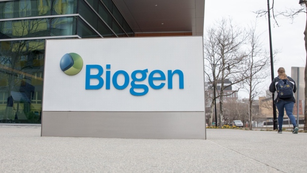A pedestrian walks past the Biogen Inc. office in Cambridge, Massachusetts, U.S., on Thursday, March 12, 2020. So far, 77 coronavirus cases have been linked to a conference Biogen held in Boston on Feb. 26. Photographer: Scott Eisen/Bloomberg