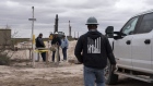 Workers with S&J Contractors lay a pipeline in Lea County, New Mexico, U.S., on Thursday, Sept. 10