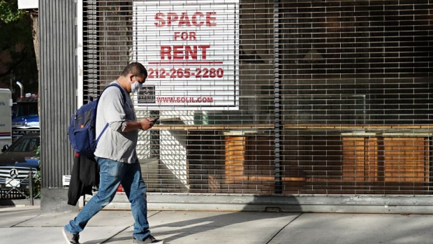 NEW YORK, NEW YORK - OCTOBER 19: A man wearing a protective mask walks by a closed cafe with a sign in the window reading 'SPACE FOR RENT' as the city continues the re-opening efforts following restrictions imposed to slow the spread of coronavirus on October 19, 2020 in New York City. The pandemic has caused long-term repercussions throughout the tourism and entertainment industries, including short-term and permanent closures of historic and iconic venues, and costing the city and businesses billions in revenue. (Photo by Cindy Ord/Getty Images)