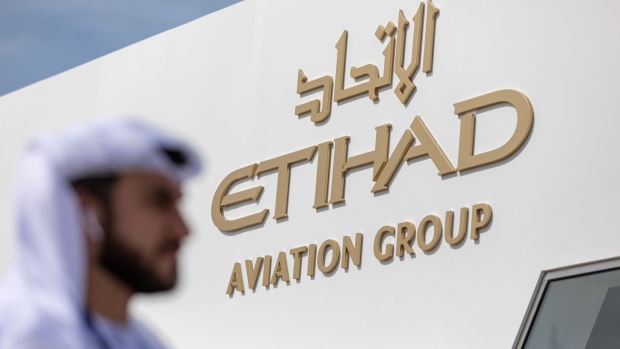 The Etihad Airways logo sits on their pavilion during the first day of the 16th Dubai Air Show at Dubai World Central (DWC) in Dubai, United Arab Emirates, on Sunday, Nov. 17, 2019. The Dubai Air Show is the biggest aerospace event in the Middle East, Asia and Africa and runs Nov. 17 - 21. Photographer: Christopher Pike/Bloomberg