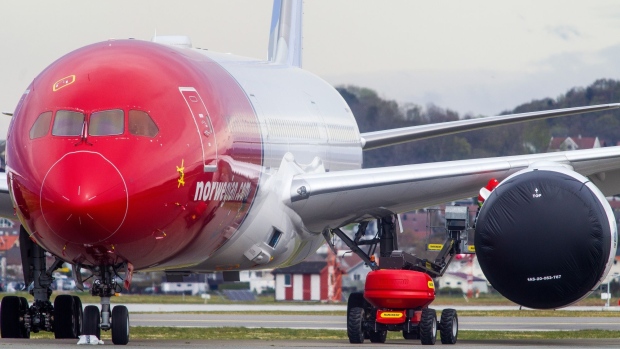 A passenger aircraft, operated by Norwegian Air Shuttle ASA, sits grounded at Stavanger Airport in Stavanger, Norway, on Thursday, April 30, 2020. Norwegian, the low-cost carrier fighting to qualify for a bailout, presented a plan to relieve part of its heavy debt burden that would largely wipe out existing shareholders and warned most flights would stay grounded until next year. Photographer: Carina Johansen/Bloomberg