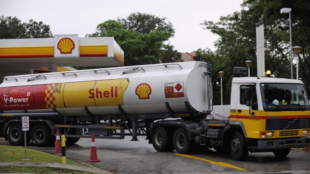 A Royal Dutch Shell Plc delivery truck arrives to upload gasoline supplies at a Shell gas station in Singapore. Singapore is Asia’s largest oil-trading and storage center, with local product supply dominated by Shell’s Pulau Bukom.