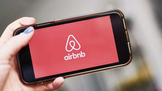 AirBnb Inc. signage is displayed on an smartphone in an arranged photograph taken in the Brooklyn borough of New York, U.S., on Friday, April 17, 2020. 