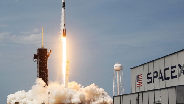 CAPE CANAVERAL, FLORIDA - MAY 30: The SpaceX Falcon 9 rocket with the manned Crew Dragon spacecraft attached takes off from launch pad 39A at the Kennedy Space Center on May 30, 2020 in Cape Canaveral, Florida. 