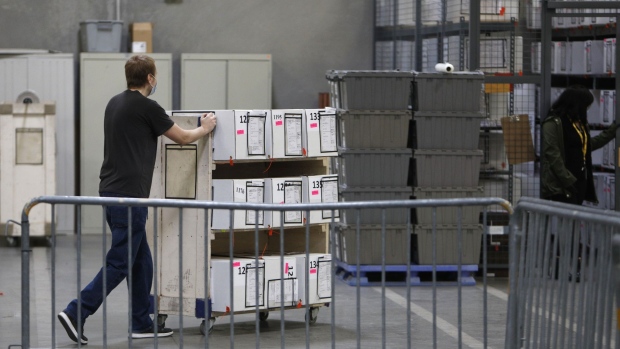 A worker pushes a cart with boxes of ballots at the Clark County Election Department in North Las Vegas, Nevada, U.S., on Thursday, Nov. 5, 2020. Democratic nominee Joe Biden is closing in on the 270 electoral votes he needs to win the presidency, while President Donald Trump’s path to re-election has narrowed. Biden needs a win in one more state -- Pennsylvania, Georgia, Nevada or North Carolina -- provided that other race calls stand. Photographer: Joe Buglewicz/Bloomberg