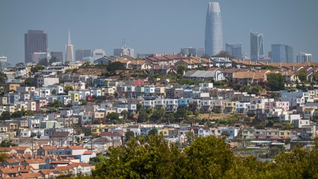 Homes stand in front of the San Francisco skyline in San Francisco, California, U.S., on Thursday, July 2, 2020. Rents for San Francisco and Silicon Valley hubs such as Mountain View and Palo Alto have seen rents plunge -- a sign residents of the tech-heavy region are taking advantage of remote work arrangements to flee to cheaper areas. Photographer: David Paul Morris/Bloomberg
