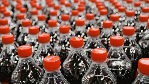 Plastic bottles of Coke soda move along the automated production line at the Coca-Cola Hellenic Bottling Co. SA plant in Brovary, Ukraine, on Wednesday, May 10, 2017. Heineken NV, Coca-Cola HBC AG and Castel Group are among companies bidding for a majority stake in Coca-Cola Beverages Africa, according to people familiar with the matter.