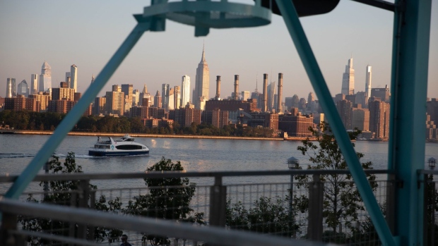 A ferry traveling up the East River seen from the in the Williamsburg neighborhood in Brooklyn borough of New York, U.S., on Friday, Sept. 4, 2020. U.S. stocks fell to a two-week low as megacap tech shares came under pressure for a second day, but came off their lows as the holiday weekend approached. Photographer: Michael Nagle/Bloomberg