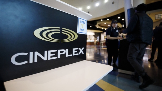 Signage is displayed inside a Cineplex Cinemas movie theater in Toronto, Ontario, Canada on Monday, Feb. 3, 2020. Britain's Cineworld Group Plc is on track to become North America's biggest operator of movie theaters with its plan to buy Canada's Cineplex Inc. for C$2.15 billion ($1.64 billion).