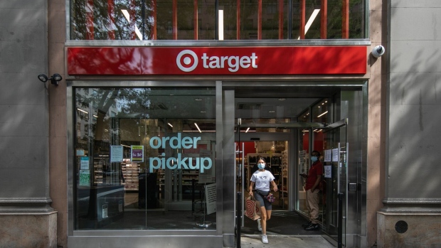 A shopper wearing a protective mask leaves a Target Corp. store in New York, U.S., on Saturday, Aug. 15, 2020. Target is scheduled to release earnings figures on August 19.