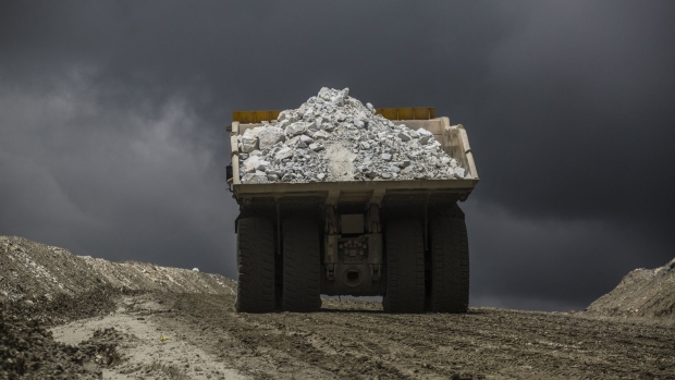 A mining truck carries minerals to be milled at the Ferrobamba pit, one of the three pits that will be mined by MMG Ltd.'s Las Bambas, in the Challhuahuacho district of Peru, on Monday, Jan. 23, 2017. Peru posted its biggest trade surplus in five years in December, as rising copper output and higher prices boosted exports. The South American country last year overtook China to became the world's biggest copper producer after Chile, allowing it to record its first annual trade surplus in three years. Photographer: Dado Galdieri/Bloomberg