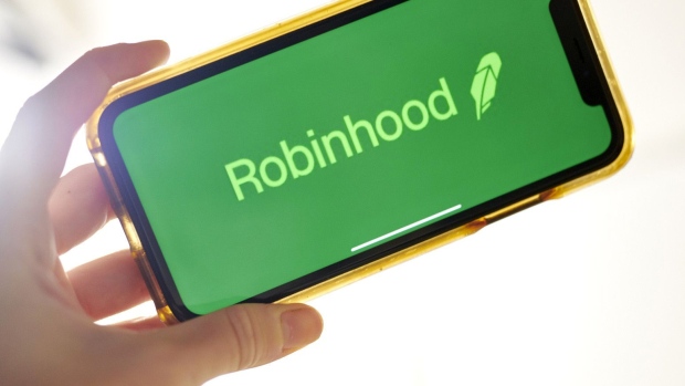 The logo for Robinhood is displayed on a smartphone in an arranged photograph taken in the Brooklyn borough of New York, on Oct. 12. Photographer: Gabby Jones/Bloomberg