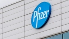 A logo at a Pfizer Inc. facility in Puurs, Belgium, on Tuesday, Nov. 10, 2020. A vaccine developed by Pfizer Inc. and BioNTech SE protects most people from Covid-19, according to a study whose early findings sent stock prices surging and were hailed by the top U.S. infectious-disease specialist as “extraordinary.” Photographer: Geert Vanden Wijngaert/Bloomberg