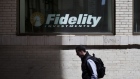 Traffic and pedestrians pass a Fidelity Investments office in Boston. Photographer: JB Reed/Bloomberg