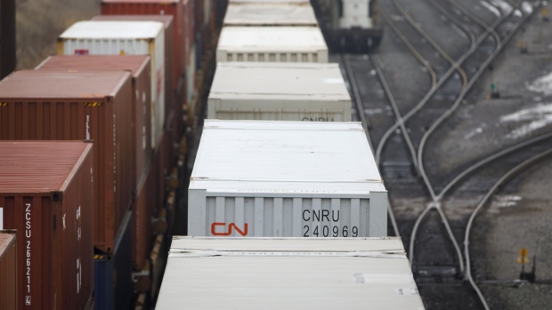 Canadian National Railway Co. containers sit on tracks at the Intermodal Terminals in Brampton, Ontario, Canada, on Tuesday, Nov. 19, 2019. About 3,200 workers at CN Rail went on strike at midnight Tuesday, threatening to crimp shipments of oil, potash and grain across the country.