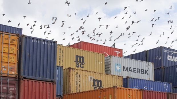 Birds fly over shipping containers at Ray-mont Logistiques Inc. in Montreal, Quebec, Canada, on Friday, Aug. 21, 2020. 