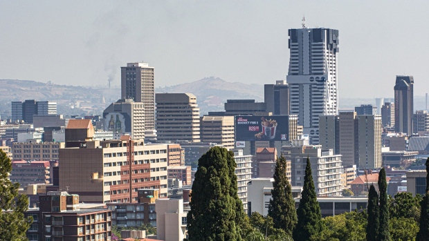 The South African Reserve Bank, South Africa's central bank, right, stands on the skyline in Pretoria, South Africa, on Tuesday, June 4 2019. South Africa’s central bank won’t bail out the country’s troubled state-owned companies including power utility Eskom Holdings SOC Ltd. because it would fuel inflation, Governor Lesetja Kganyago said. Photographer: Waldo Swiegers/Bloomberg