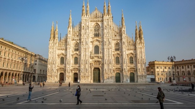 Pedestrian in the Duomo square, in view of Duomo Cathedral in Milan, Italy, on Friday, Nov. 6, 2020. Italy targeted the financial capital of Milan and key industrial hubs in the north with a set of tough new restrictions, risking more damage to the country’s fragile economy in a bid to rein in the spread of the coronavirus. Photographer: Francesca Volpi/Bloomberg