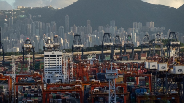 Shipping containers and gantry cranes at the Kwai Tsing Container Terminal in Hong Kong, China, on Wednesday, Sept. 16, 2020. Hong Kong's economy is showing the first signs of emerging from a crippling recession sparked by political unrest last year and deepened by the global pandemic. Photographer: Billy H.C. Kwok/Bloomberg