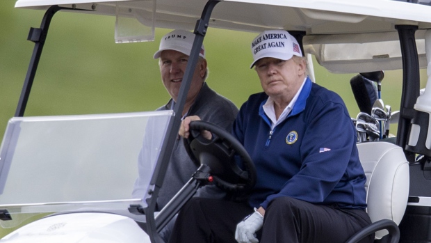 STERLING, VIRGINIA - NOVEMBER 22: U.S. President Donald Trump (R) golfs at Trump National Golf Club on November 22, 2020 in Sterling, Virginia. The previous day Preisdent Donald Trump left a G20 summit virtual event “Pandemic Preparedness” to visit one of his golf clubs as virus has now killed more than 250,000 Americans. (Photo by Tasos Katopodis/Getty Images)