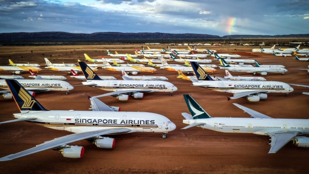 Serviced aircraft are sealed and stored at the Asia Pacific Aircraft Storage Facility (APAS) in Alice Springs, Northern Territory, Australia, on Thursday, Oct. 22, 2020. The APAS facility makes a strange and eerie sight, with the flat landscape punctuated by familiar tall tail fins against a brooding desert sky. More than 100 Aircraft are stored at the purpose-built facility adjacent to the airport, which can keep jets maintained and ready to be brought back into service when needed.