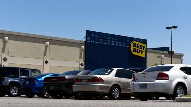 Vehicles sit parked outside a Best Buy Co. store in San Antonio, Texas.