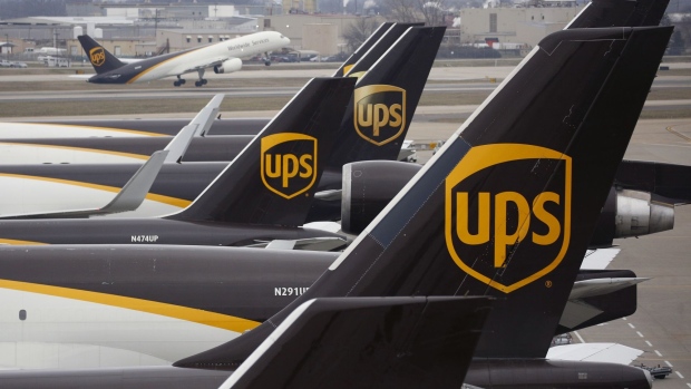 United Parcel Service Inc. (UPS) logos are displayed on the tail of cargo jets parked at a UPS Worldport facility in Louisville, Kentucky, U.S., on Tuesday, Jan. 28, 2020. United Parcel Service Inc. is scheduled to release earnings figures on January 30. Photographer: Luke Sharrett/Bloomberg