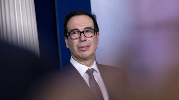 Steven Mnuchin, U.S. Treasury secretary, listens during a news conference in Washington, D.C., U.S., on Monday, March 9, 2020. President Donald Trump said Monday he will seek a payroll tax cut and "very substantial relief" for industries that have been hit by the virus, reversing course on the need for economic stimulus hours after markets posted their worst losses in more than a decade.