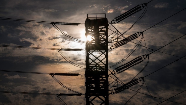 Power lines stand in Crockett, California, U.S., on Monday, Aug. 17, 2020. As many as 10 million Californians were supposed go dark on Monday in an unprecedented series of rolling blackouts designed to save the power grid from the worst heat wave in 70 years. But temperatures fell, people turned down their air conditioners and utilities called off the outages. Photographer: David Paul Morris/Bloomberg