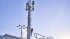 An engineer climbs a 5G telecommunication network mast at the Vodafone Kabel Deutschland GmbH campus in Duesseldorf, Germany, on Tuesday, Jan. 21, 2020. The European Union wont explicitly ban Huawei Technologies Co. or other 5G equipment vendors when the bloc unveils guidelines for member states to mitigate security risks. 