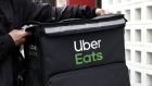 An Uber Eats delivery courier closes a delivery backpack after collecting a take-out order at the Mainichi Yakuzen Soup Plus shop in Tokyo, Japan, on Tuesday, April 21, 2020. District of Shibya is promoting food delivery services by providing various discounts for those who order food through Uber Eats, Demae-can or other major delivery companies. Photographer: Kiyoshi Ota/Bloomberg