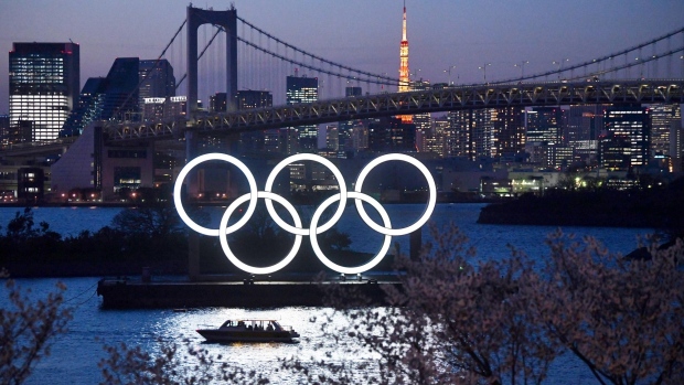 TOKYO, JAPAN - MARCH 25: A boat sails past the Tokyo 2020 Olympic Rings on March 25, 2020 in Tokyo, Japan. Following yesterdays announcement that the Tokyo 2020 Olympics will be postponed to 2021 because of the ongoing Covid-19 coronavirus pandemic, IOC officials have said they hope to confirm a new Olympics date as soon as possible. (Photo by Carl Court/Getty Images)
