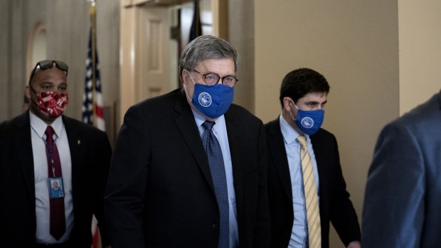 William Barr, U.S. attorney general, center, wears a protective mask while departing from the U.S. Capitol in Washington, D.C., U.S., on Monday, Nov. 9, 2020. Few Republican officeholders have been willing to publicly dispute President Donald Trump as he attacks the integrity of the election system, underscoring how he will remain a potent force in GOP politics even if he ultimately loses the White House.