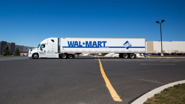 A Wal-Mart Stores Inc. truck sits parked in front of the company's fulfillment center in Bethlehem, Pennsylvania, U.S., on Wednesday, March 29, 2017. Wal-Mart Stores Inc. acquired e-commerce startup Jet.com for $3.3 billion in cash and stock. Jet.com Founder and his management team were put in charge of Wal-Mart's entire domestic e-commerce operation, overseeing more than 15,000 employees in Silicon Valley, Boston, Omaha, and its home office in Arkansas. Photographer: Michael Nagle/Bloomberg