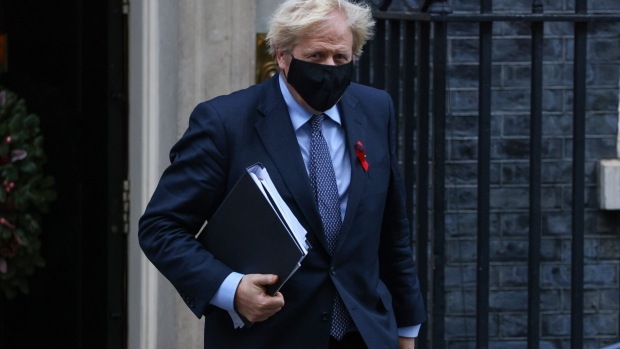 Boris Johnson, U.K. prime minister, departs from number 10 Downing Street on his way to Parliament in London, U.K., on Tuesday, Dec. 1, 2020. Boris Johnson is battling to convince his own Conservative Party colleagues to back plans to keep most of England under strict pandemic controls when the national lockdown ends this week.