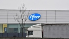 A haulage truck passes at the Pfizer Inc. facility in Puurs, Belgium, on Thursday, Dec. 3, 2020. The quick approval of Pfizer Inc.’s coronavirus vaccine in the U.K. isn’t likely to accelerate the availability of the shot in Asia, as countries work to complete local safety tests and negotiate deals. Photographer: Geert Vanden Wijngaert/Bloomberg