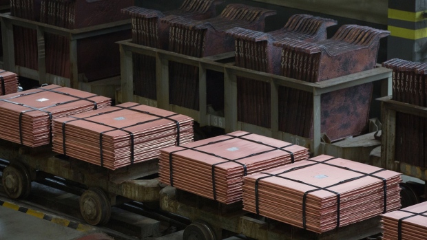 Newly-made copper cathode sheets stancd stacked on wagons before they are moved from the electrolysis shop at the Uralelectromed Copper Refinery, operated by Ural Mining and Metallurgical Co. (UMMC), in Verkhnyaya Pyshma, Russia, on Thursday, July 30, 2020. Gold surged to a fresh record Friday fueled by a weaker dollar and low interest rates. Silver headed for its best month since 1979. Photographer: Andrey Rudakov/Bloomberg