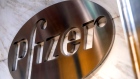 Pfizer Inc. signage is displayed outside the company's headquarters in New York, U.S., on Wednesday, July 22, 2020. U.S. health officials agreed pay $1.95 billion for 100 million doses of a vaccine made by Pfizer Inc. and BioNTech SE, the latest step in an effort to fight the coronavirus pandemic. Photographer: Bloomberg/Bloomberg