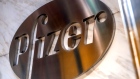 Pfizer Inc. signage is displayed outside the company's headquarters in New York, U.S., on Wednesday, July 22, 2020. U.S. health officials agreed pay $1.95 billion for 100 million doses of a vaccine made by Pfizer Inc. and BioNTech SE, the latest step in an effort to fight the coronavirus pandemic. 